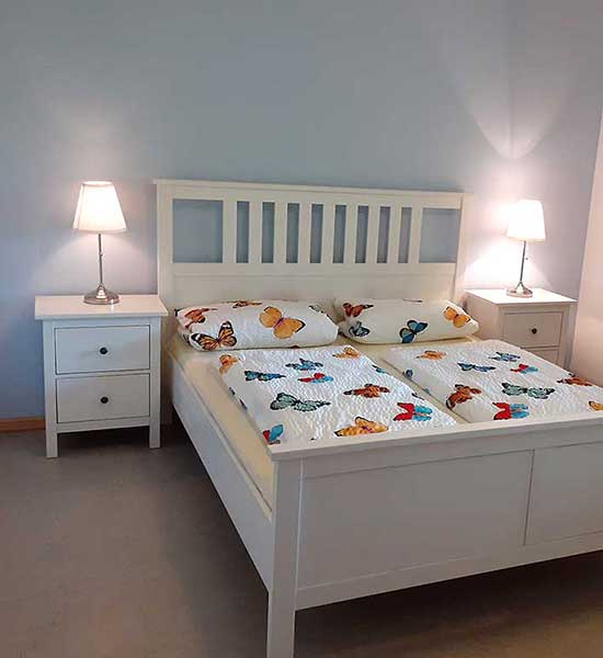 Schlafzimmer in der Ferienwohnung Strohboden